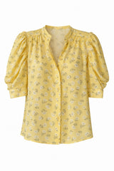 Women's shirt with covered button up front and puff sleeves perfect for everyday wear. 