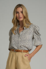 A model wearing a casual floral blouse by LILYA