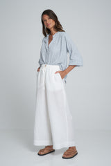 A Model Wearing White Linen Pants by LILYA