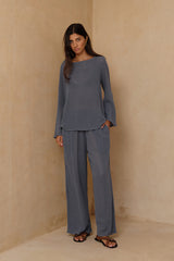 Woman wearing the Allegra Storm Blue cotton mesh top with relaxed flared sleeves