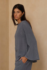Allegra Storm Blue top showing wide rounded neckline and flared sleeves