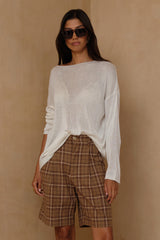 Sand plaid Bermuda shorts styled with oversized blazer and relaxed knit 