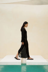 Relaxed black maxi dress styled casually