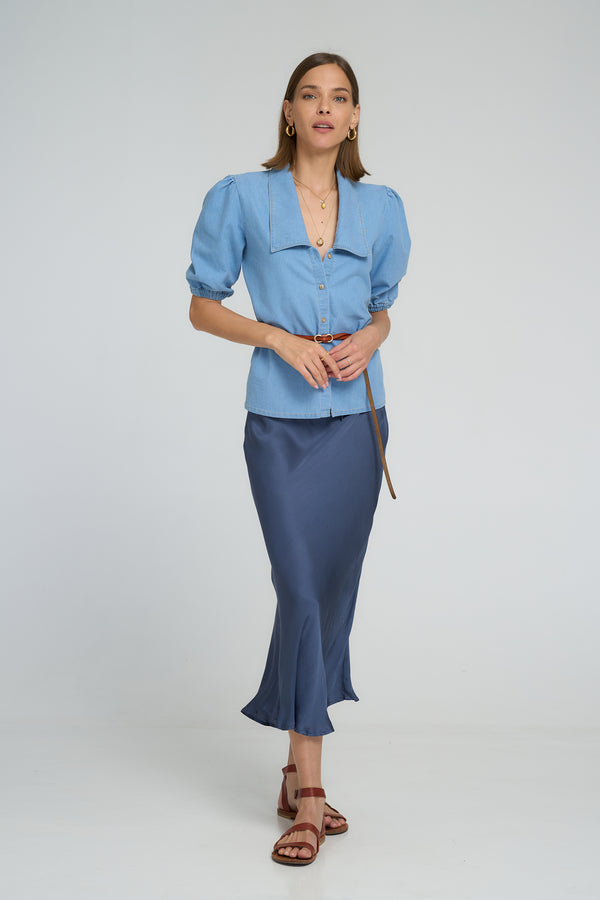 Woman wearing LILYA Lunar Skirt with flowy drape