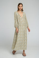 Woman wearing long floral maxi dress with 3/4 elastic sleeves in soft rayon fabric 