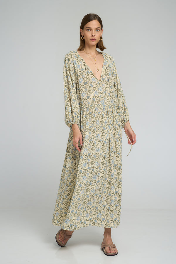 Woman wearing long floral maxi dress with 3/4 elastic sleeves in soft rayon fabric 