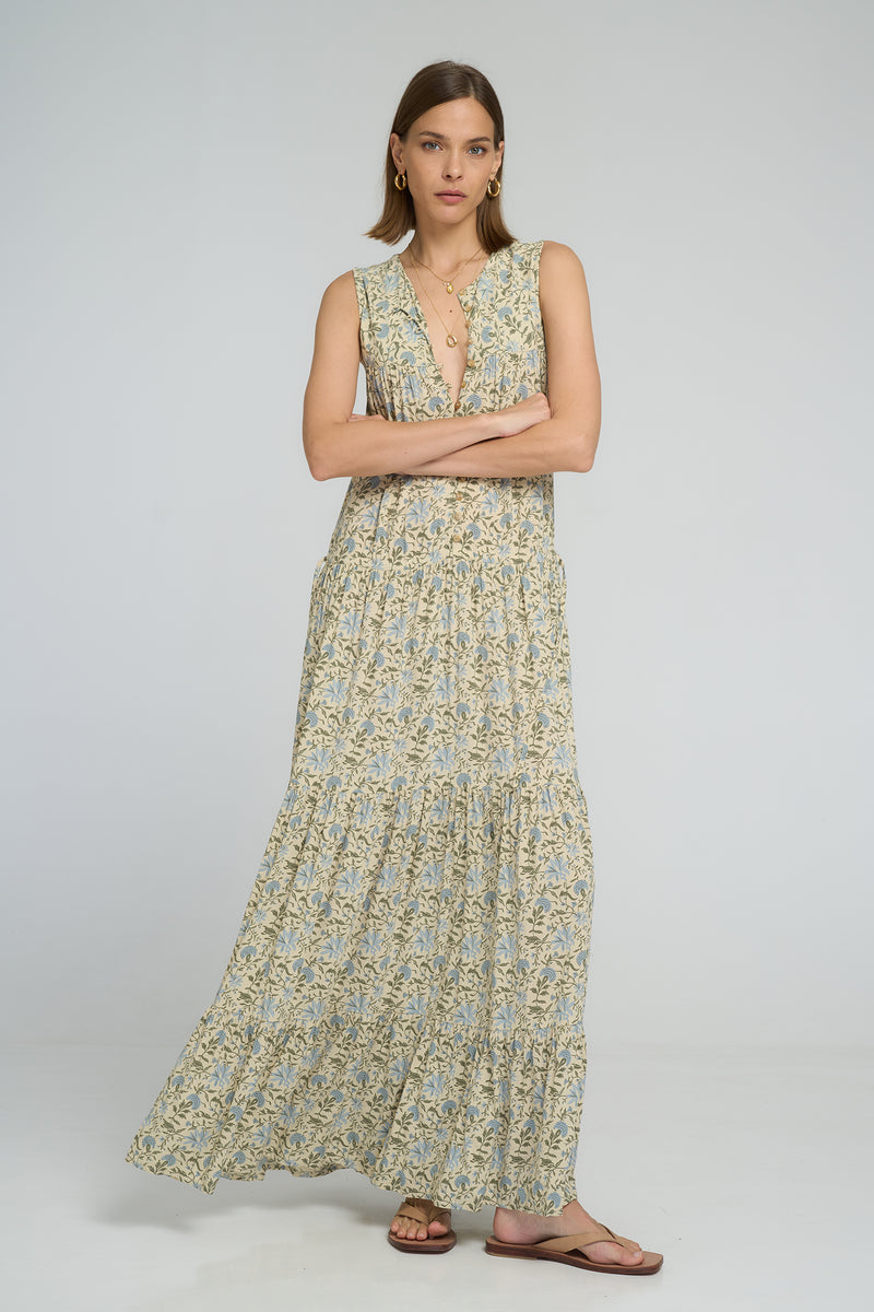 Model wearing Calvi Dress Fleur Des Champs, relaxed sleeveless maxi dress.