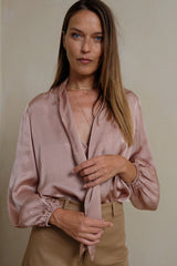 Front view of silk-touch blouse with tie