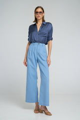High-waisted cotton chambray pants with loose leg fit styled with a navy shirt