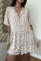 Model wears everyday mini dress designed for comfort, movement and simplicity in pink print