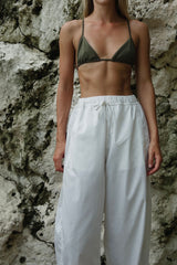 Coastal holiday outfit featuring relaxed white wide leg pants