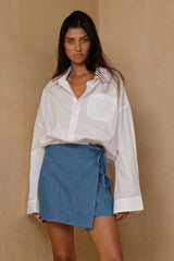 Chambray wrap mini skirt styled casually with a white top