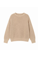 Ghost image of a soft oversized knit offering effortless movement and relaxed femininity