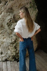 Mid blue relaxed fit jeans styled for warm Australian weather