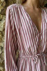 Feminine striped top with adjustable waist and soft flowing silhouette
