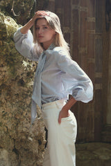Wide leg cotton pants styled casually with feminine striped blouse