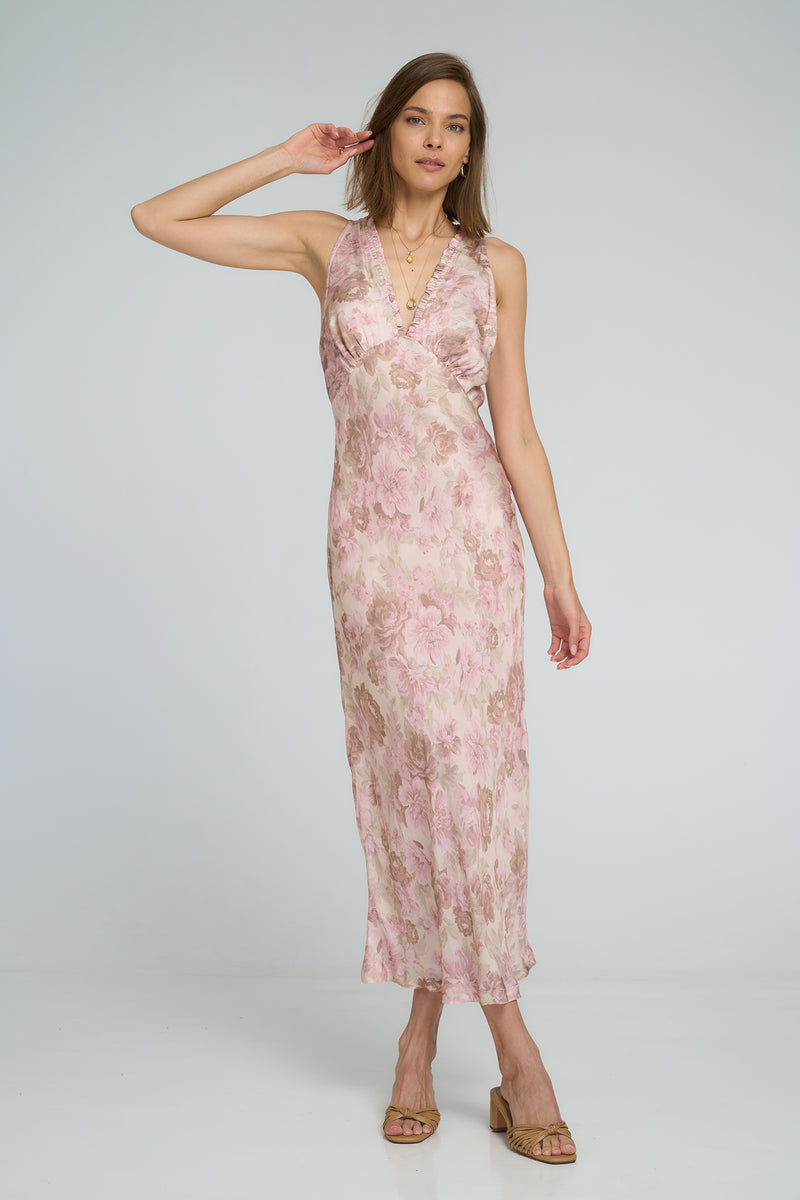Model wearing bias-cut slip dress with deep V-neckline