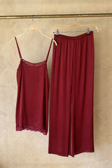 Elegant satin trousers styled casually with oversized tee and slides