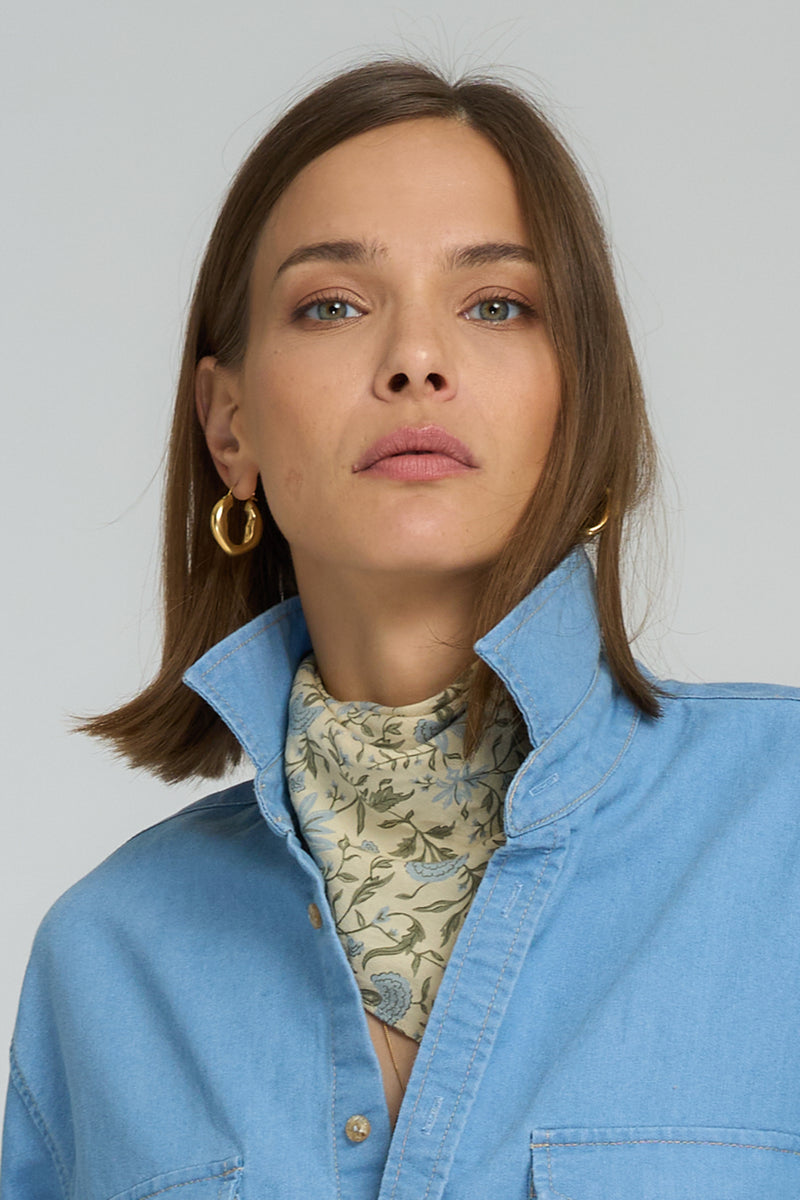 Close-up of Provence floral scarf tied around neck