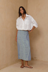 Woman wearing the Hana Teru Blue Green Print midi wrap skirt