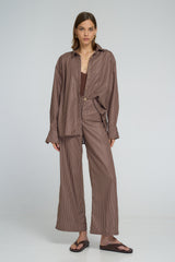 Model wearing LILYA Rio Pant and Hasting Shirt in cocoa stripe cotton