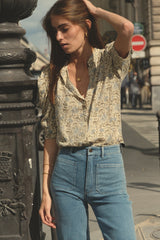 Close up of pale blue high rise jean with front pockets