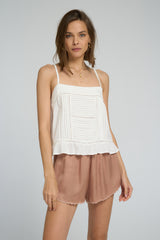 Detail shot of pintuck design and lightweight fabric texture