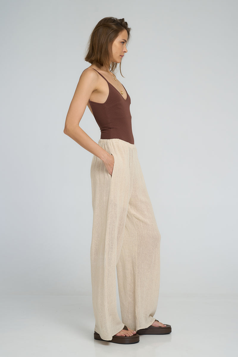 Lightweight mesh pants styled for beach and travel