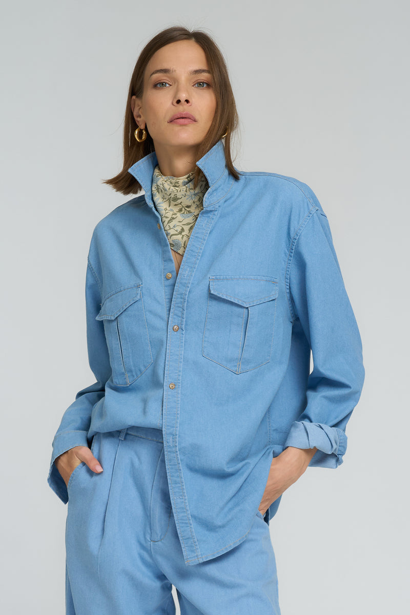 Relaxed fit chambray shirt in washed light blue styled with wide-leg cotton pants
