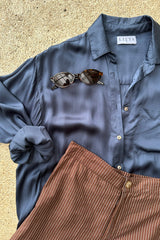 A close up of the blue Roshi Shirt by Lilya