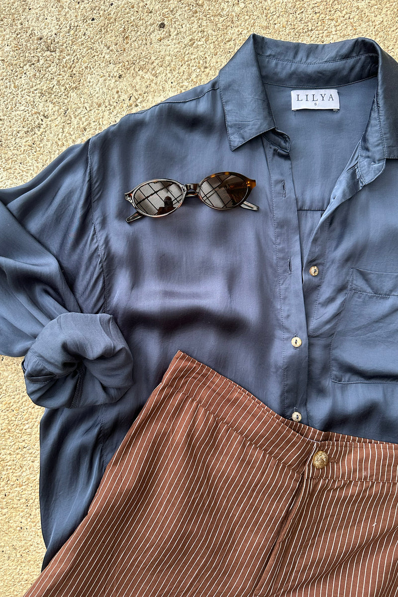 A close up of the blue Roshi Shirt by Lilya