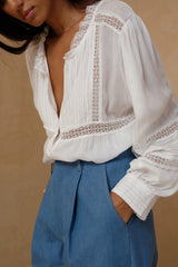 Feminine white blouse designed for effortless everyday dressing