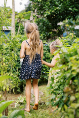 Back view of the Yarrow Navy mini girls pinafore. 