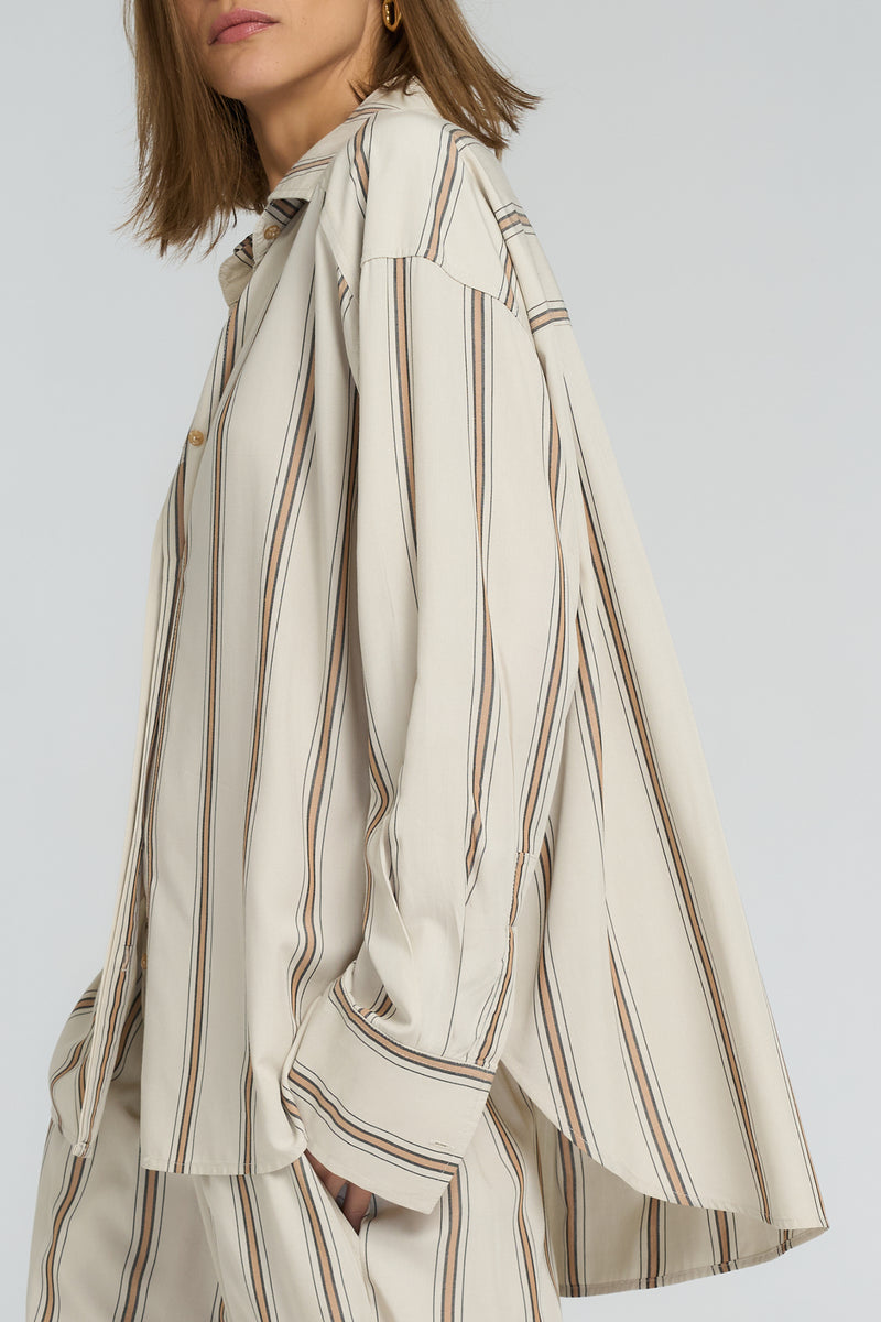 Close-up of wide cuffs and scooped hem on Hastings Shirt