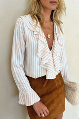 Close up photo of mdoel wearing lilya striped shirt in stripe print