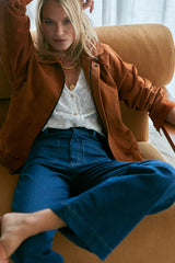 Side view showing black lining and suede texture