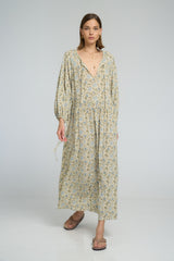 Soft rayon floral dress styled with adjustable neckline and flowing silhouette