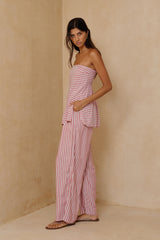 Relaxed strapless striped top styled casually with lightweight summer pants