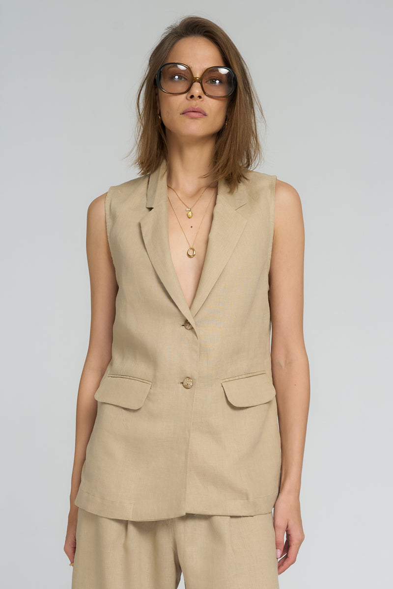 Close-up of button-front detail on sand Malachite Vest