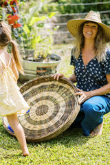 Jess wearing Monty Navy Top in her garden in Hawaii. 