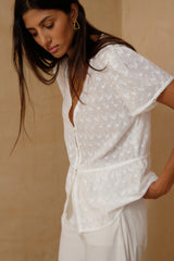 Lightweight white Monty Top styled for coastal summer dressing 