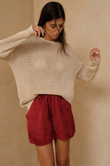 Relaxed Merlot Red satin shorts styled for effortless warm weather dressing 