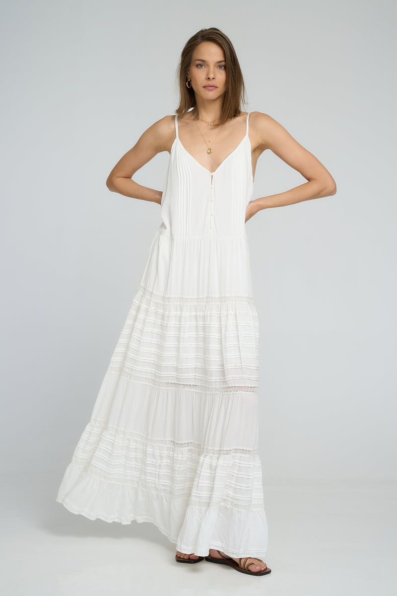 model wearing a white boho maxi dress by lilya
