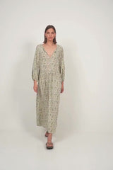 Model in relaxed fit floral dress with billowy sleeves and bohemian charm