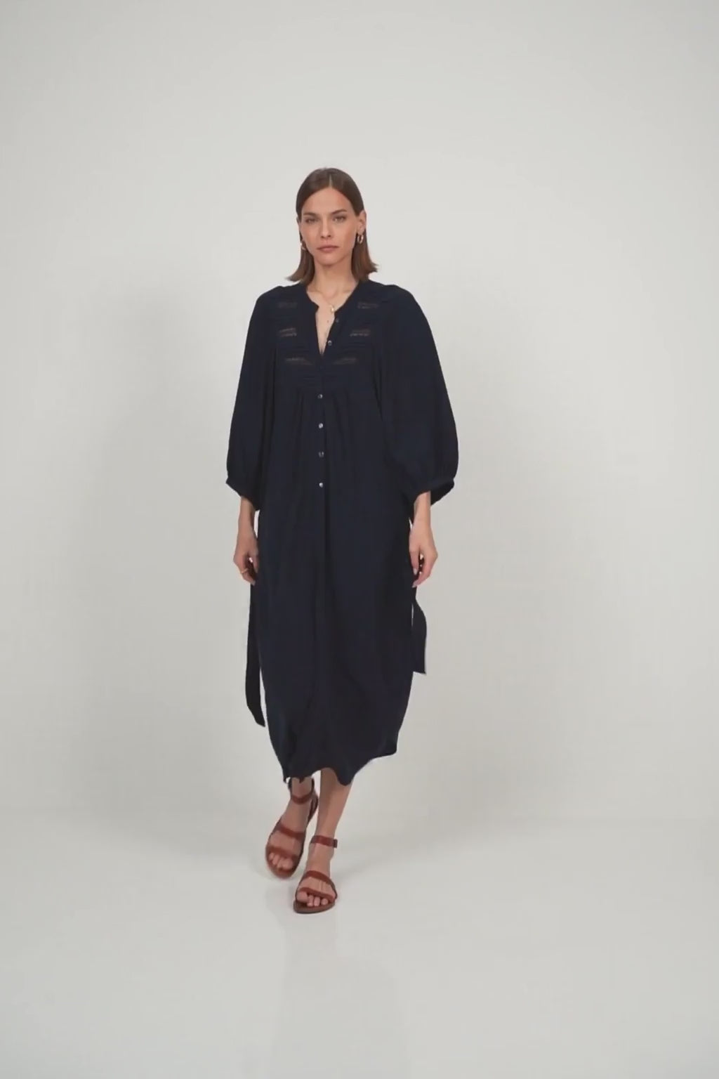 A model wearing a navy maxi dress for summer