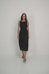 A Model Wearing a Black Linen Midi Dress for Summer