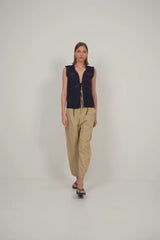 Navy sleeveless lace-trimmed cotton top paired with sand utility pants for effortless summer style