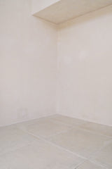 Lace-trim placket on white cotton blouse