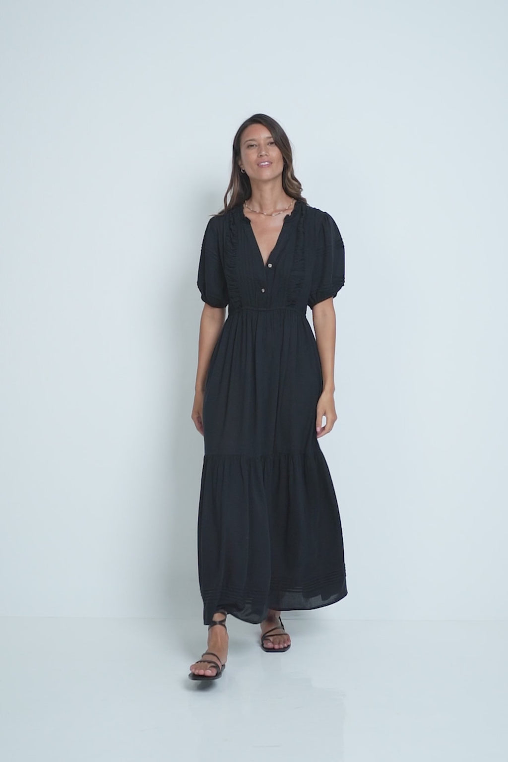 A Model Wearing a Black Classic Maxi Dress by LILYA