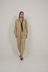 Sporty sand cotton jacket for layering, featuring functional pockets and brass snaps.